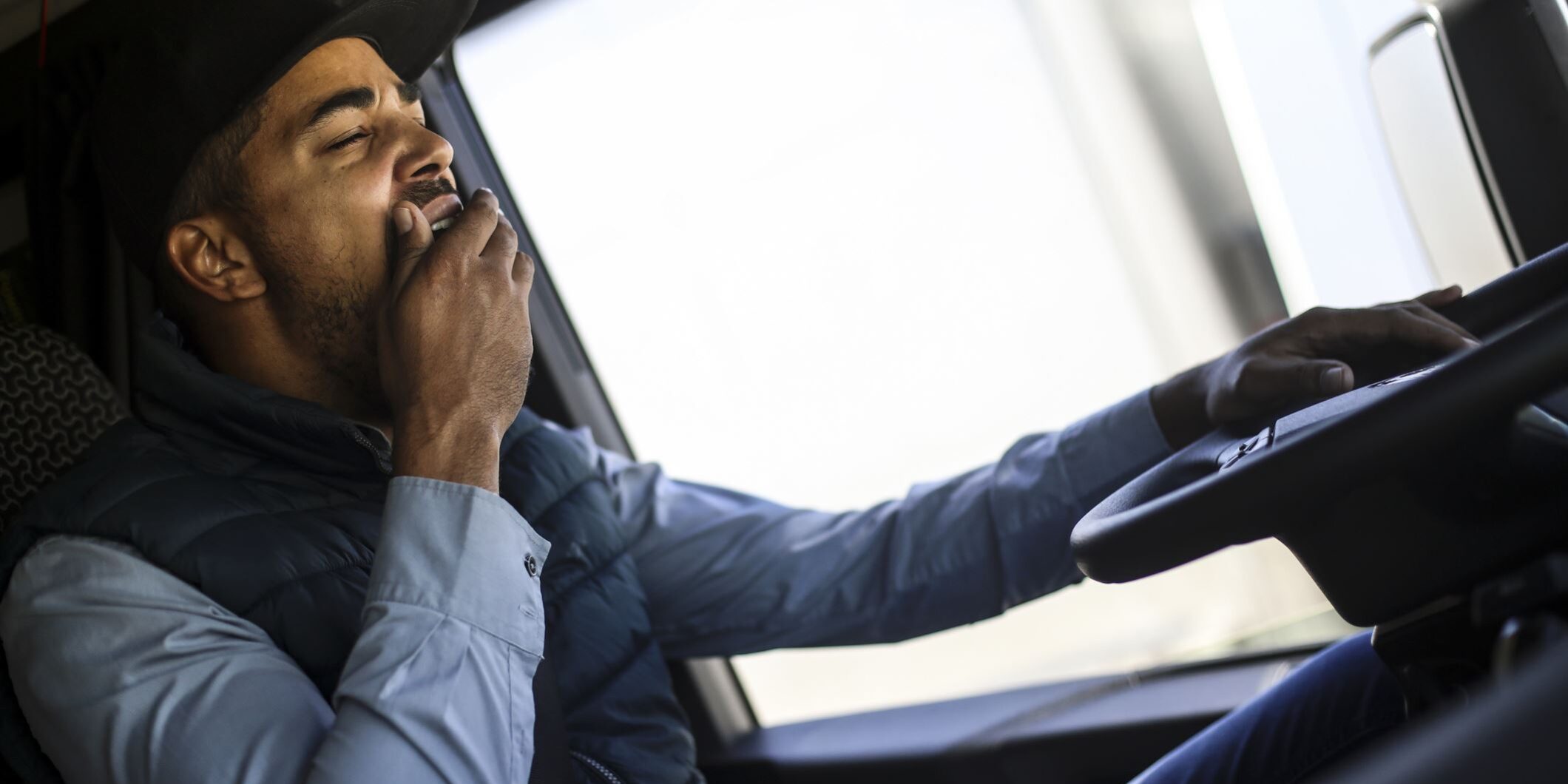 Truck Driver Yawning While Driving