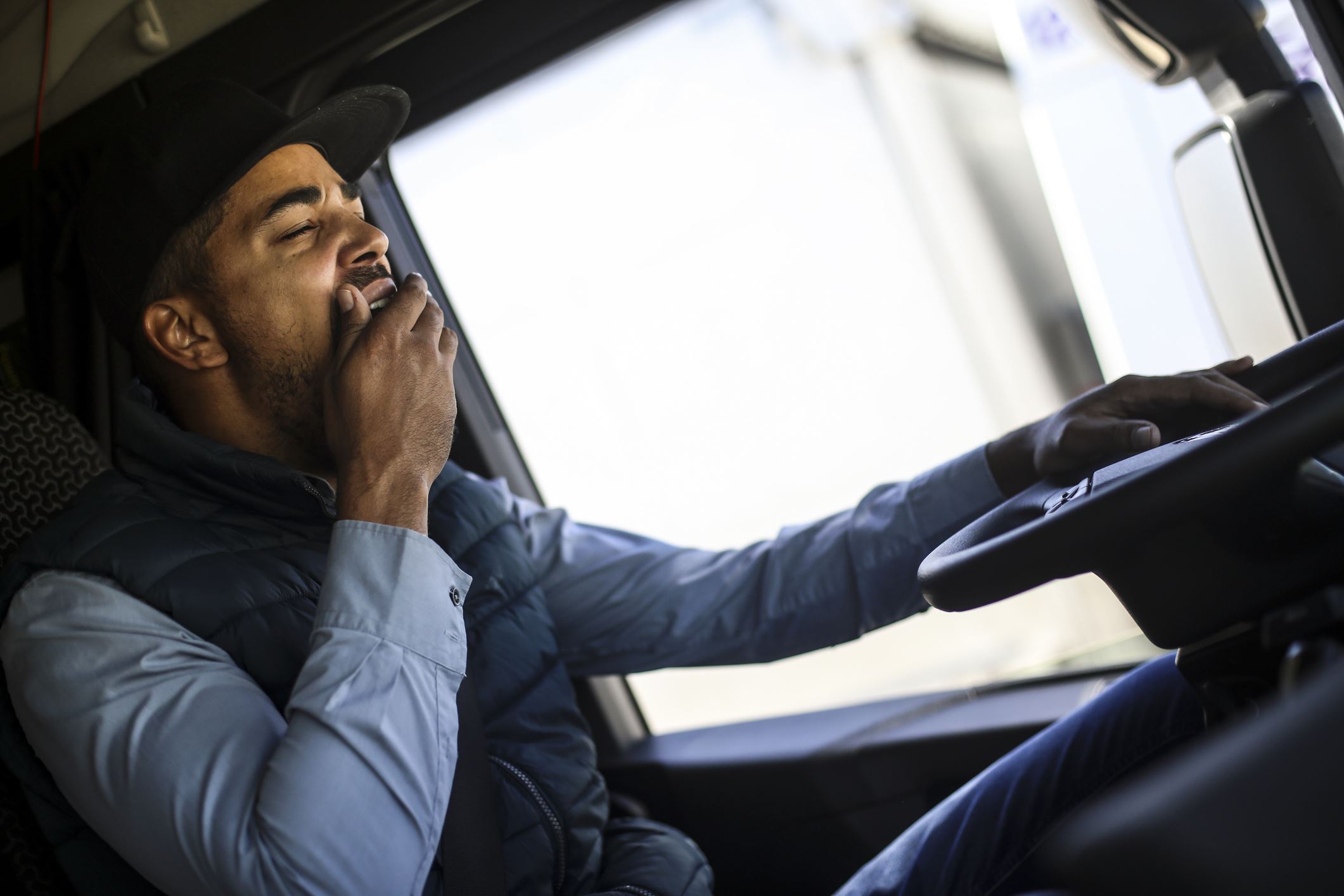 Truck Driver Yawning While Driving